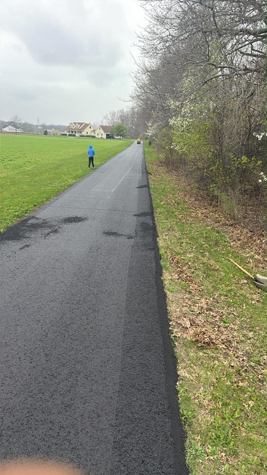 Finished asphalt pavement detail with smooth black surface